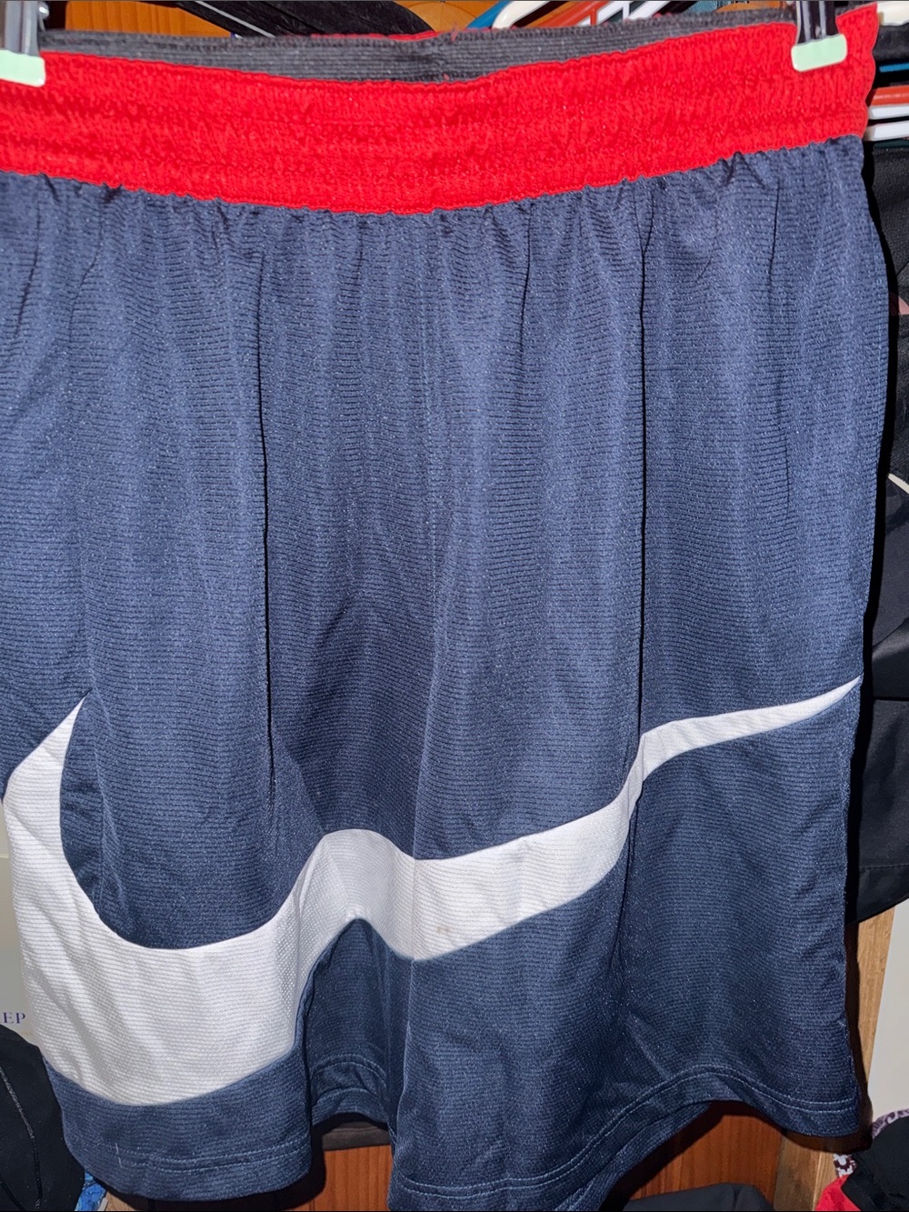 Nike Men’s Navy Blue Athletic Shorts with Red Waistband and White Swoosh